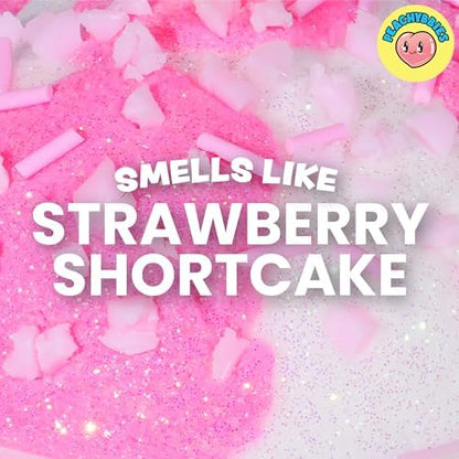Peachybbies Strawberry Cow Cloud Slime inside its reusable packaging displaying the official brand label
