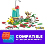Poseable Pikachu figure standing on the green grass section of the MEGA building toy kit.
