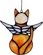 Decorative cat angel ornament catching natural sunlight