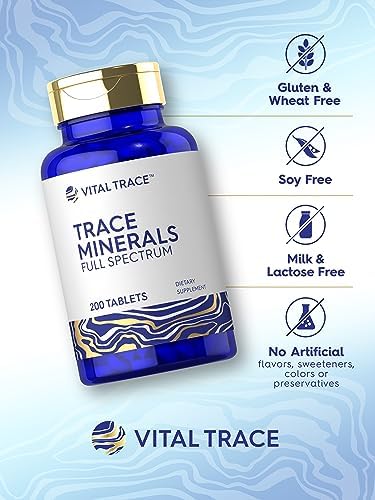 Carlyle Vital Trace Minerals dietary supplement bottle standing on a neutral lifestyle background