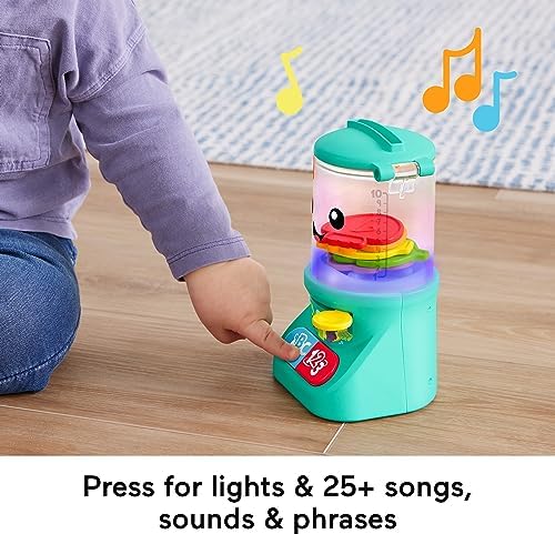 Infant educational toy blender with lid open showing put and take play feature.