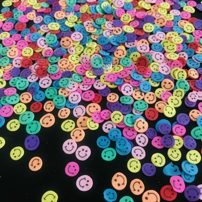 PrettyG polymer clay smiley face charms spread out to display the detailed miniature design elements.