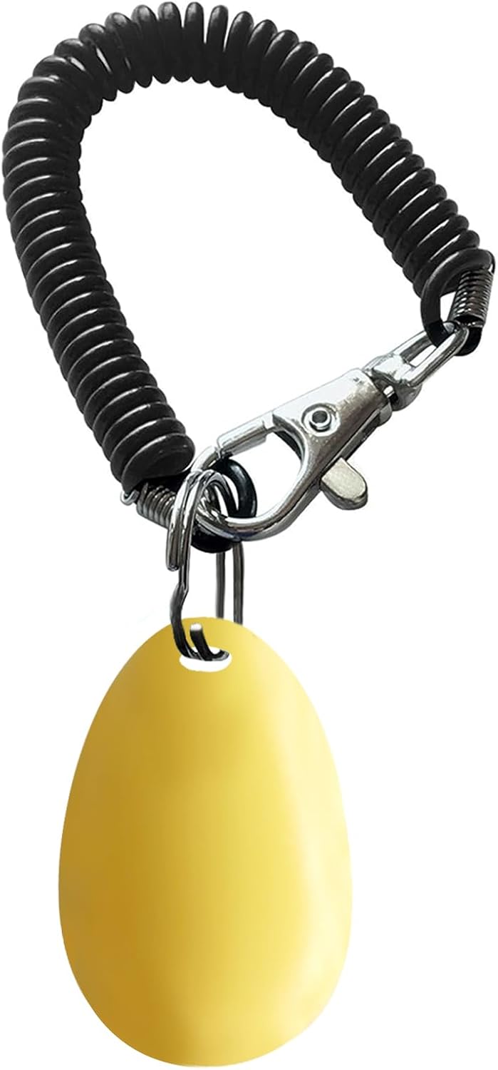 Yellow teardrop shaped pet clicker with black coiled wrist strap for secure handling.
