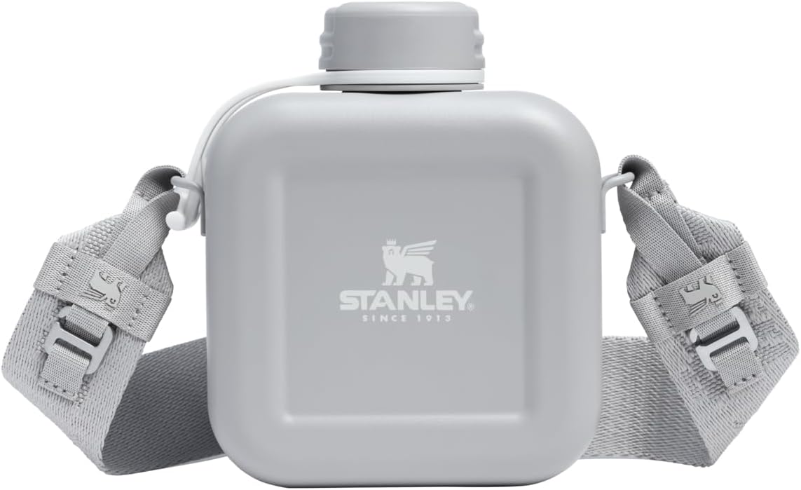 Stanley eco-friendly single wall metal canteen standing upright on a flat surface.