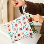 Set of two diaper storage pouches displayed together