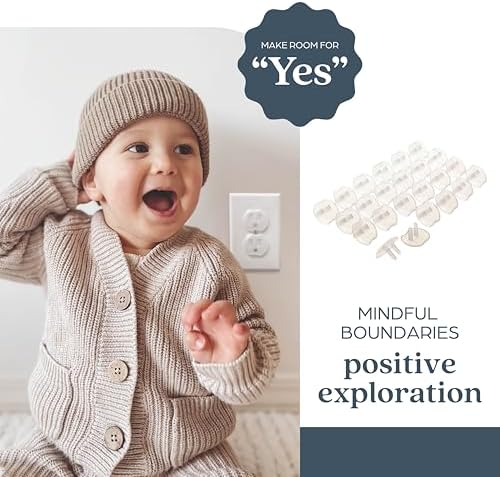 Transparent Dreambaby safety plug being inserted into wall socket