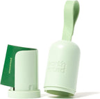 Earth Rated green leash dispenser with the adjustable silicone strap attached to a dog lead
