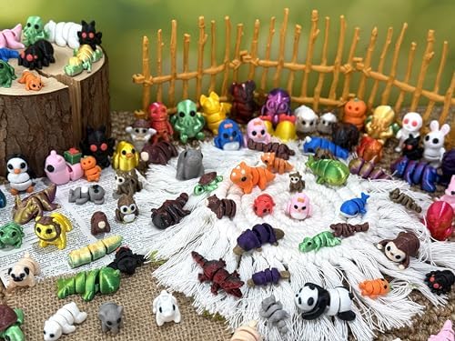 Small articulated animal toys displayed on an office desk