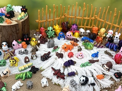 Small articulated animal toys displayed on an office desk
