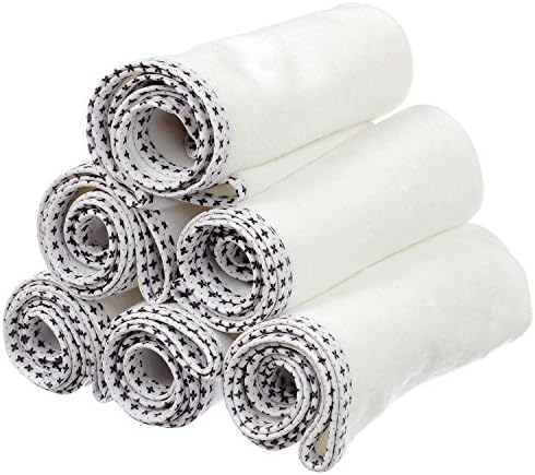 Munchkin white absorbent liner placed on top of a standard sized baby changing table station