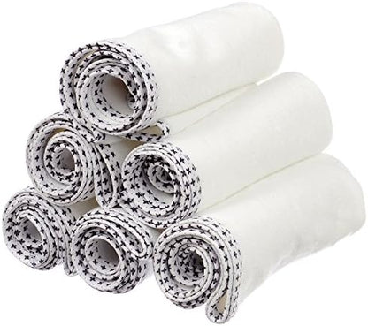 Munchkin white absorbent liner placed on top of a standard sized baby changing table station