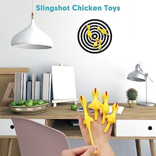 Close up view of a person stretching the tail of the flexible flying chicken toy on their finger