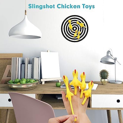Close up view of a person stretching the tail of the flexible flying chicken toy on their finger