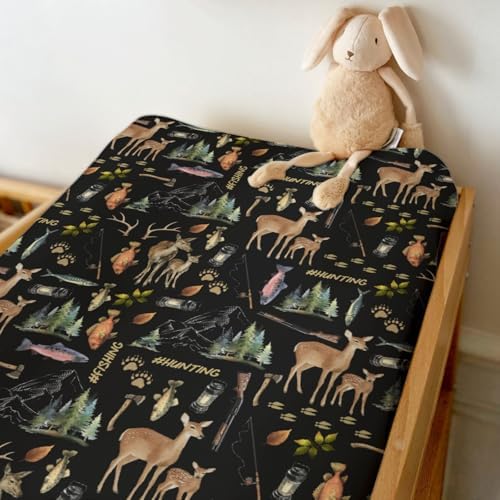 Close-up of watercolor deer and pine tree pattern on nursery sheet