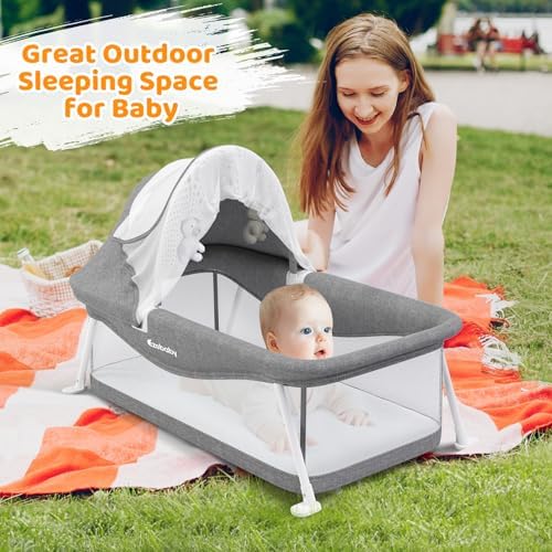 Ezebaby foldable newborn baby bed with the protective sunshade canopy fully extended.