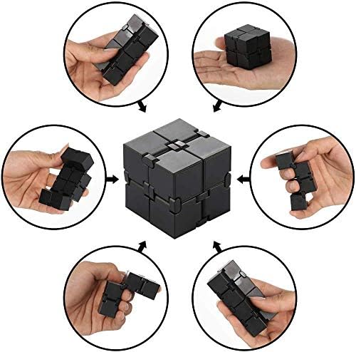 Black interlocking infinity cube fidget toy being folded for hand anxiety relief.
