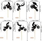 Close up view of dirt bike rider cupcake picks on display