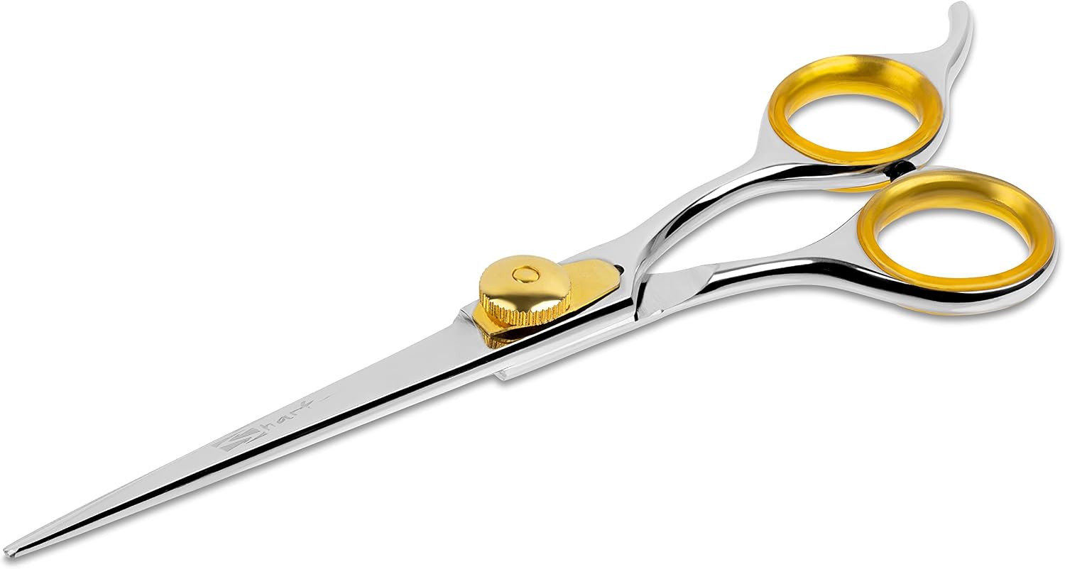 Handheld view of Sharf gold pet grooming scissors