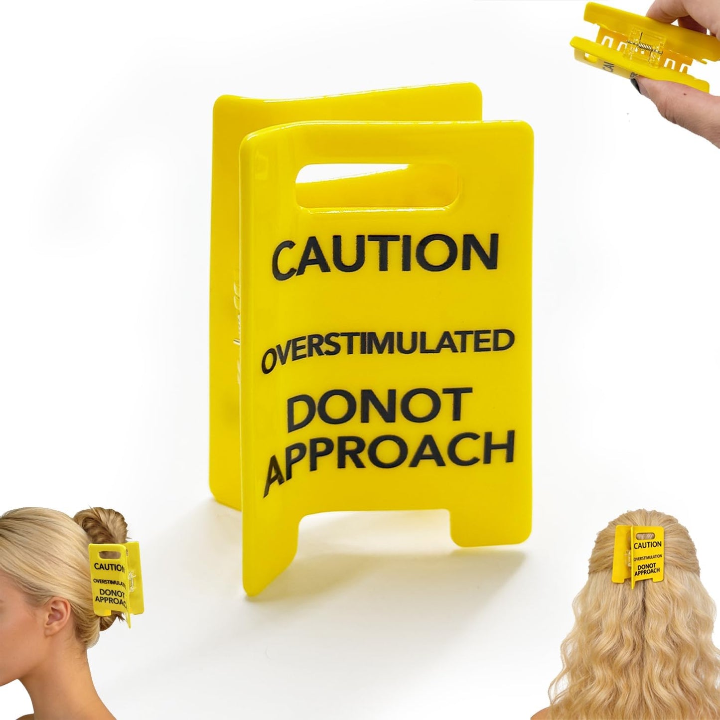 Generic overstimulated caution sign hair claw clip front view showing yellow wet floor sign design.