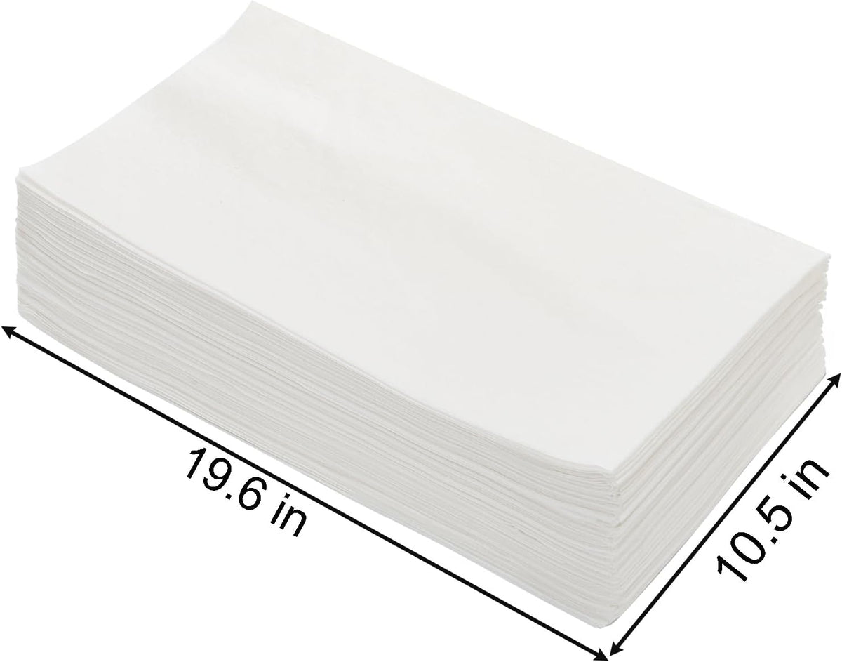Okllen disposable cage pads stacked to show white non-woven material