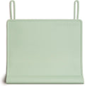 The Table Tyke Silicone Placemat Sage Green front view showcasing the patented table edge bumper on a wooden dining table
