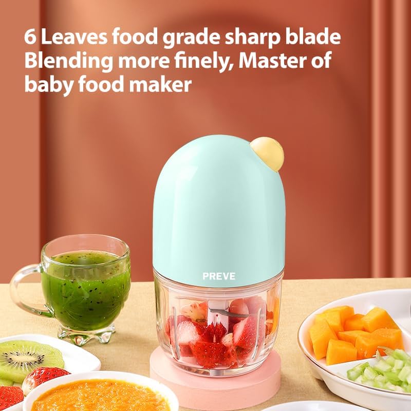 DAKONG compact puree blender in use chopping fresh vegetable pieces into a smooth texture for infant feeding.