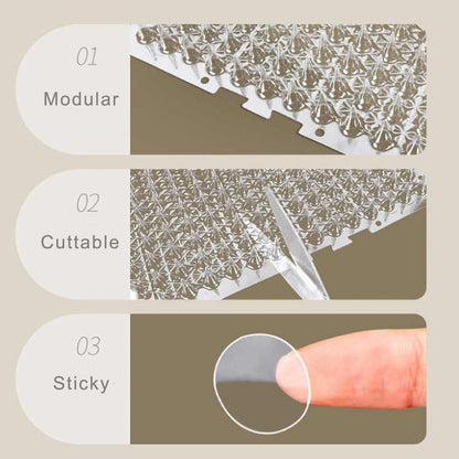 Transparent cat spike mat installed in a garden flower bed