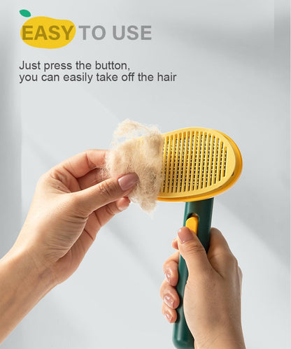 Waterproof ABS cat brush for shedding being rinsed under tap water for cleaning.