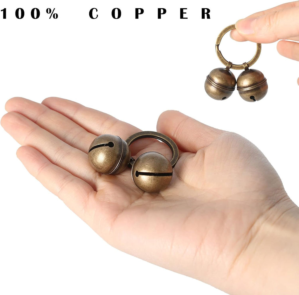 Pair of Kittail copper dog bells with stainless steel lobster clasps side by side view