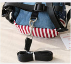 Zippered storage pouch open on small dog backpack harness