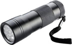 Handheld inspection blacklight torch revealing hidden pet urine stains on a domestic carpet.