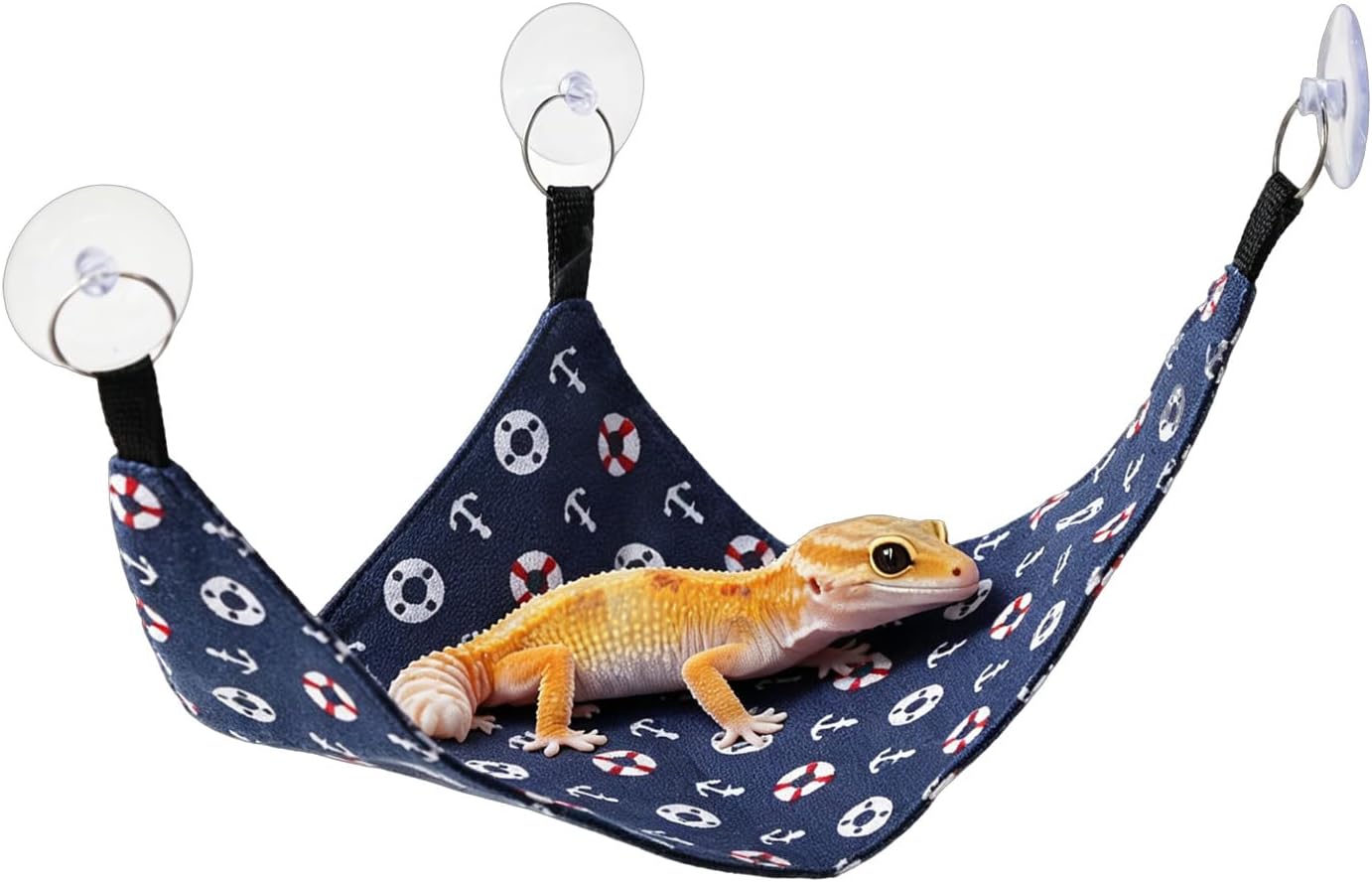Kathson bearded dragon hammock front view showing navy blue fabric with nautical anchor patterns inside a glass terrarium.