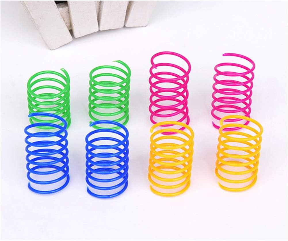 Sixty count bulk packaging of non toxic bouncing cat spiral toys spread out on a floor