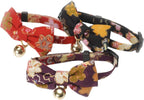 Close-up of the authentic chirimen rayon fabric texture and gold charm detail.