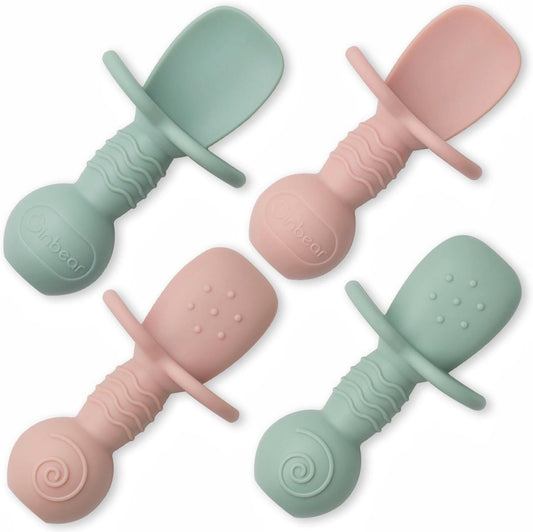 Ginbear platinum silicone baby spoons front view in hazy green and pink colors for premium infant weaning.