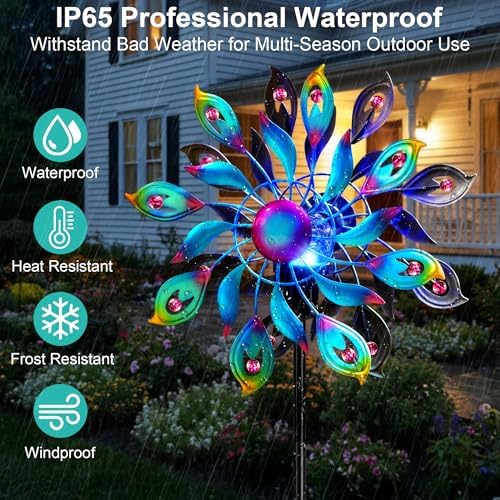 Blue metal peacock wind spinner rotating in garden
