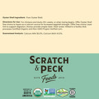 Scratch And Peck Feeds 4 lb bag next to a healthy egg