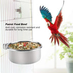 Bird feeding bowl holding seeds inside wire cage
