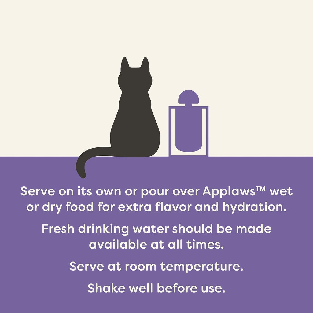 Close up of Applaws grain free savory cat food broth being poured over dry kibble.