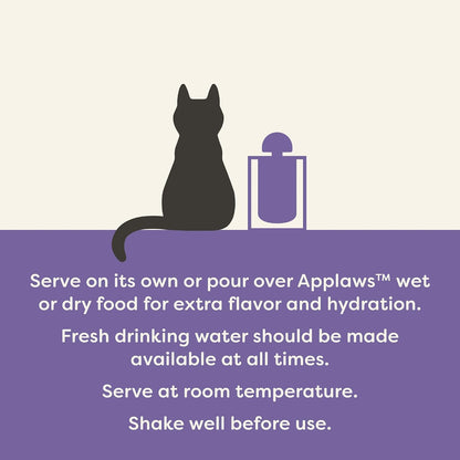 Close up of Applaws grain free savory cat food broth being poured over dry kibble.