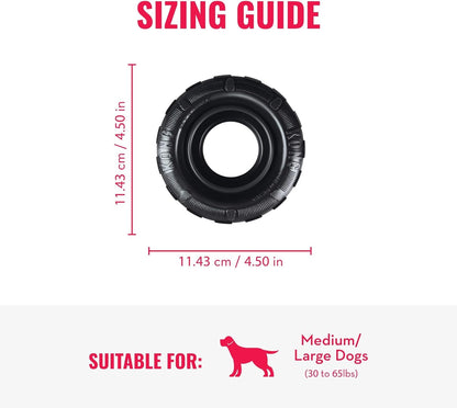 Medium to large dog playing with KONG Extreme Tires outside.