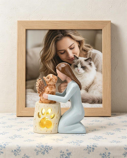 Back view showing the detailed angelic wings of the resin cat statue