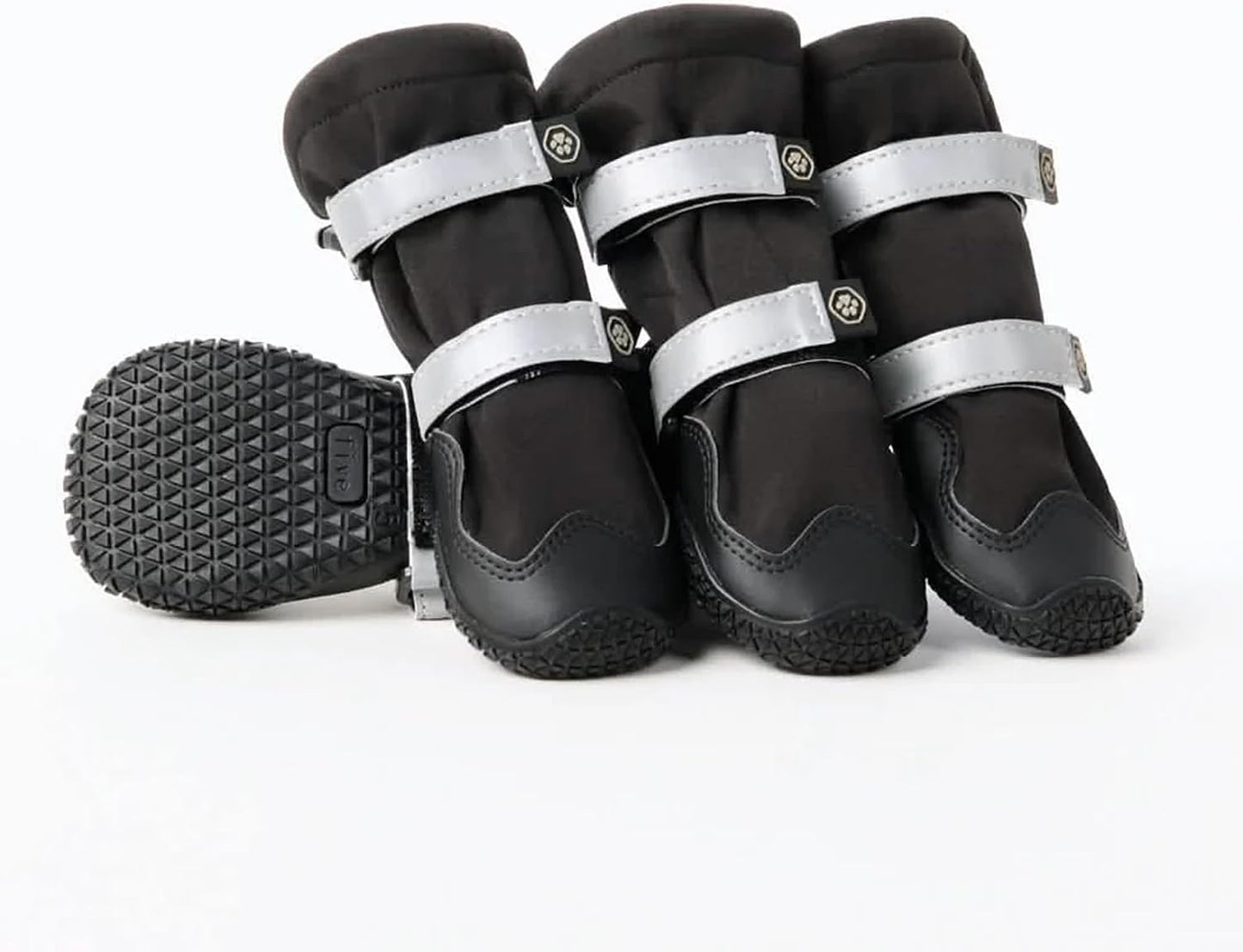 Spark Paws reflective dog boots glowing in low light for nighttime safety.
