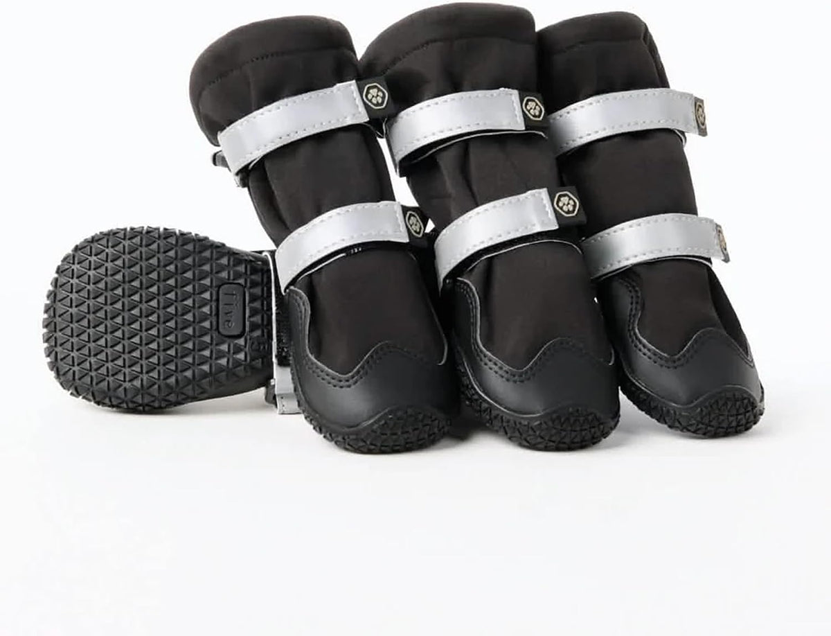 Spark Paws reflective dog boots glowing in low light for nighttime safety.