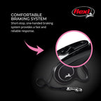 Small dog walking with black Flexi retractable cord leash