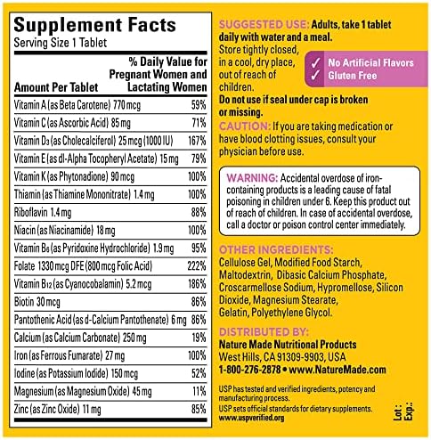 Nature Made prenatal multivitamin bottle in hand