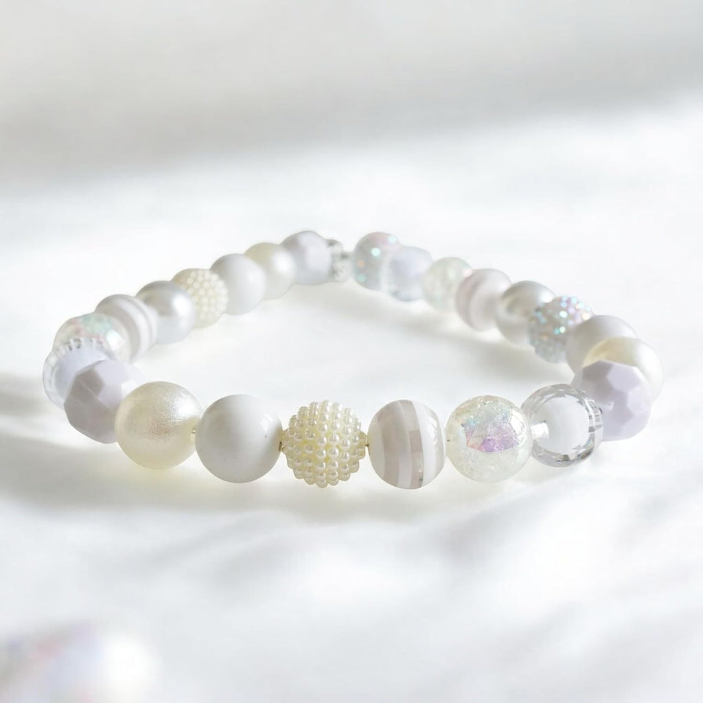 Decorative dog pearl necklace accessory being tested with the two finger safety rule on a medium breed.