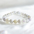 Decorative dog pearl necklace accessory being tested with the two finger safety rule on a medium breed.