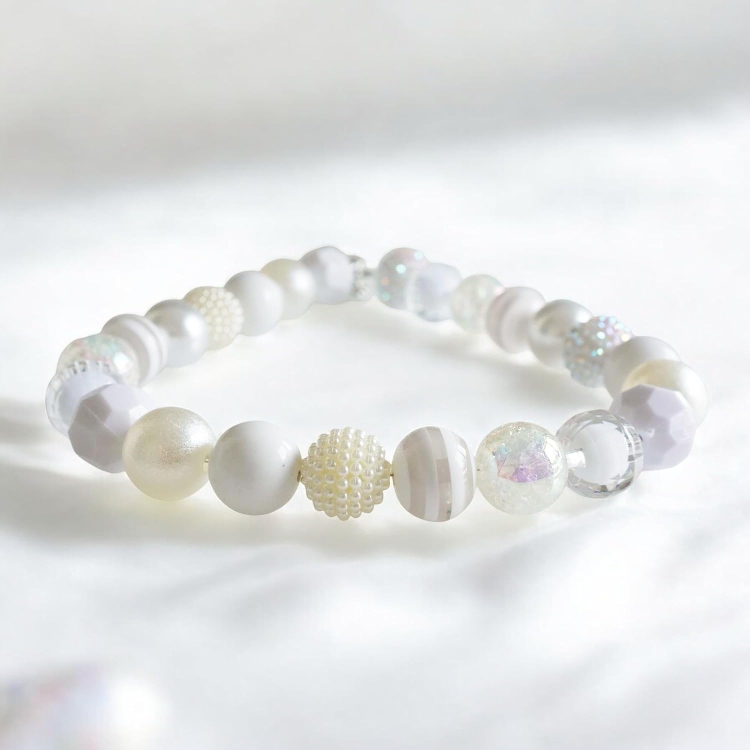 Decorative dog pearl necklace accessory being tested with the two finger safety rule on a medium breed.