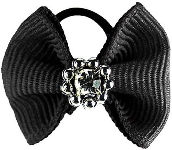Pack of sixteen authentic equestrian show bows laid out on a sheet.